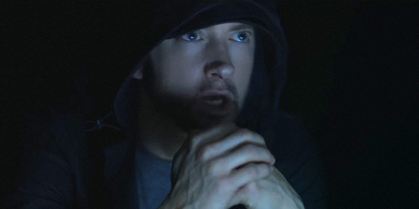 Eminem sitting in the dark