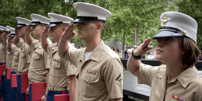 U.S. Marines salute during the re-enlistment and promotion ceremony at the National September 11 Memorial site.