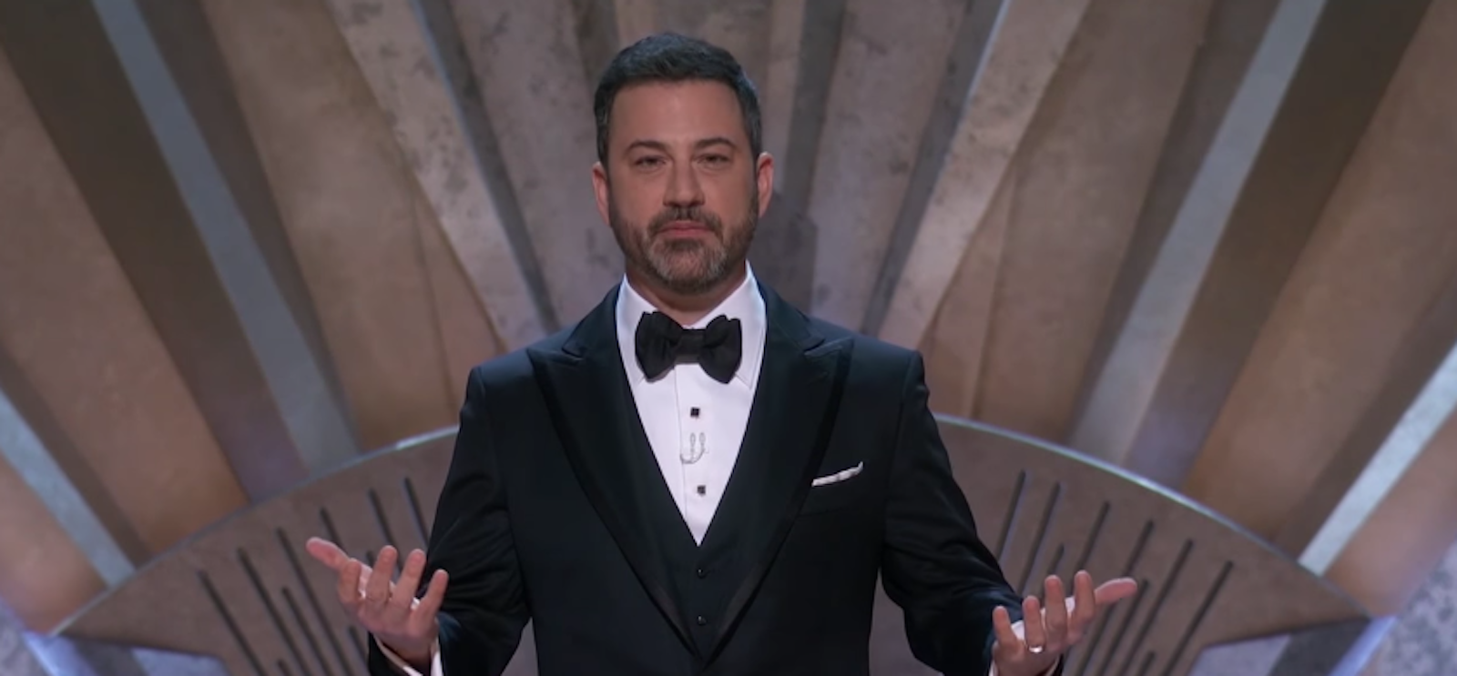 Jimmy Kimmel in a black tux onstage hosting the 2018 Oscars