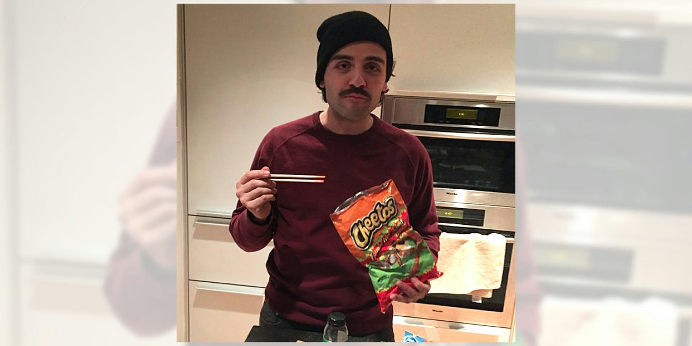 Oscar Isaac eating Cheetos with chopsticks
