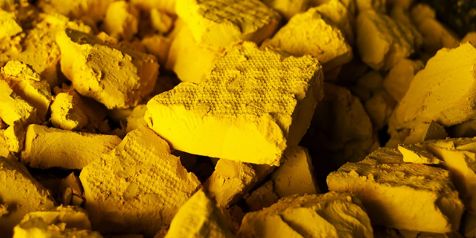 A photo of yellow cake uranium, a solid form of uranium oxide produced from uranium ore.