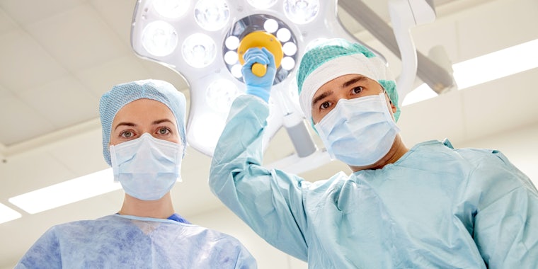 Surgeons Staring Down at Patient