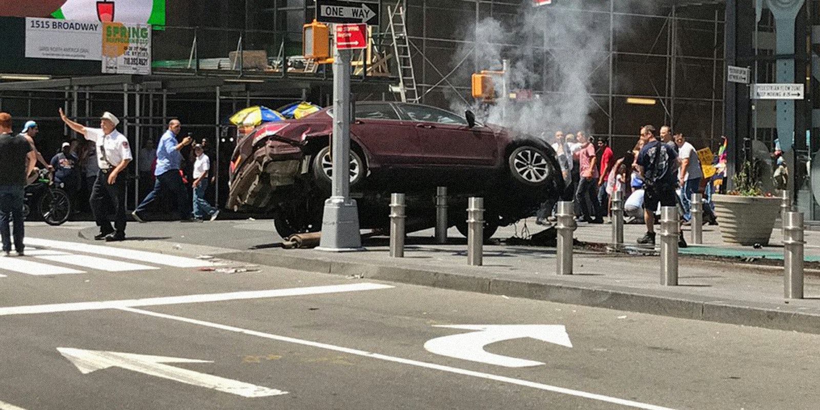 car crashed up on bollards in Times Square with pedestrians and police nearby