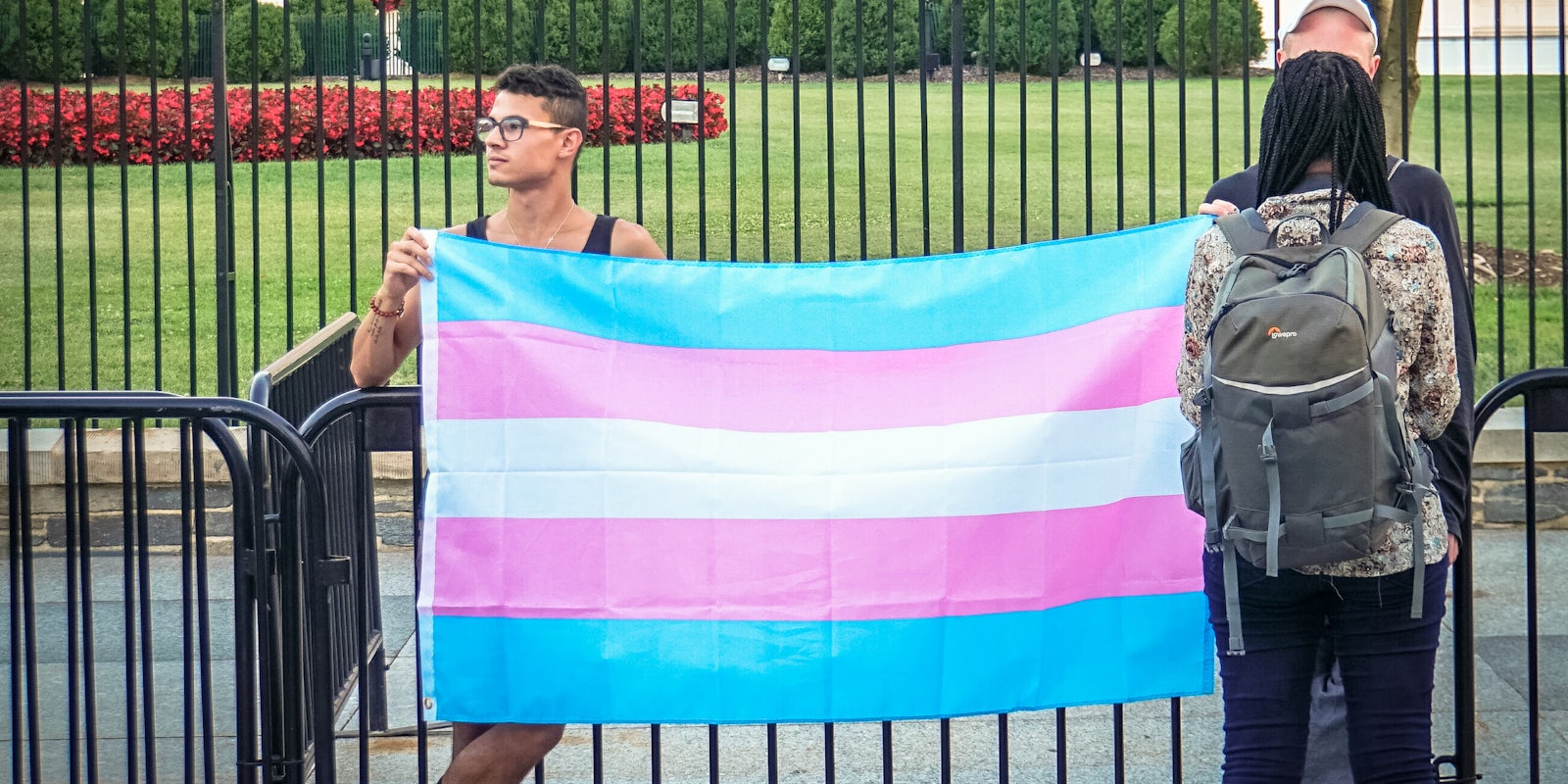 Trans activists protest the Trump administration's trans military ban announcement.