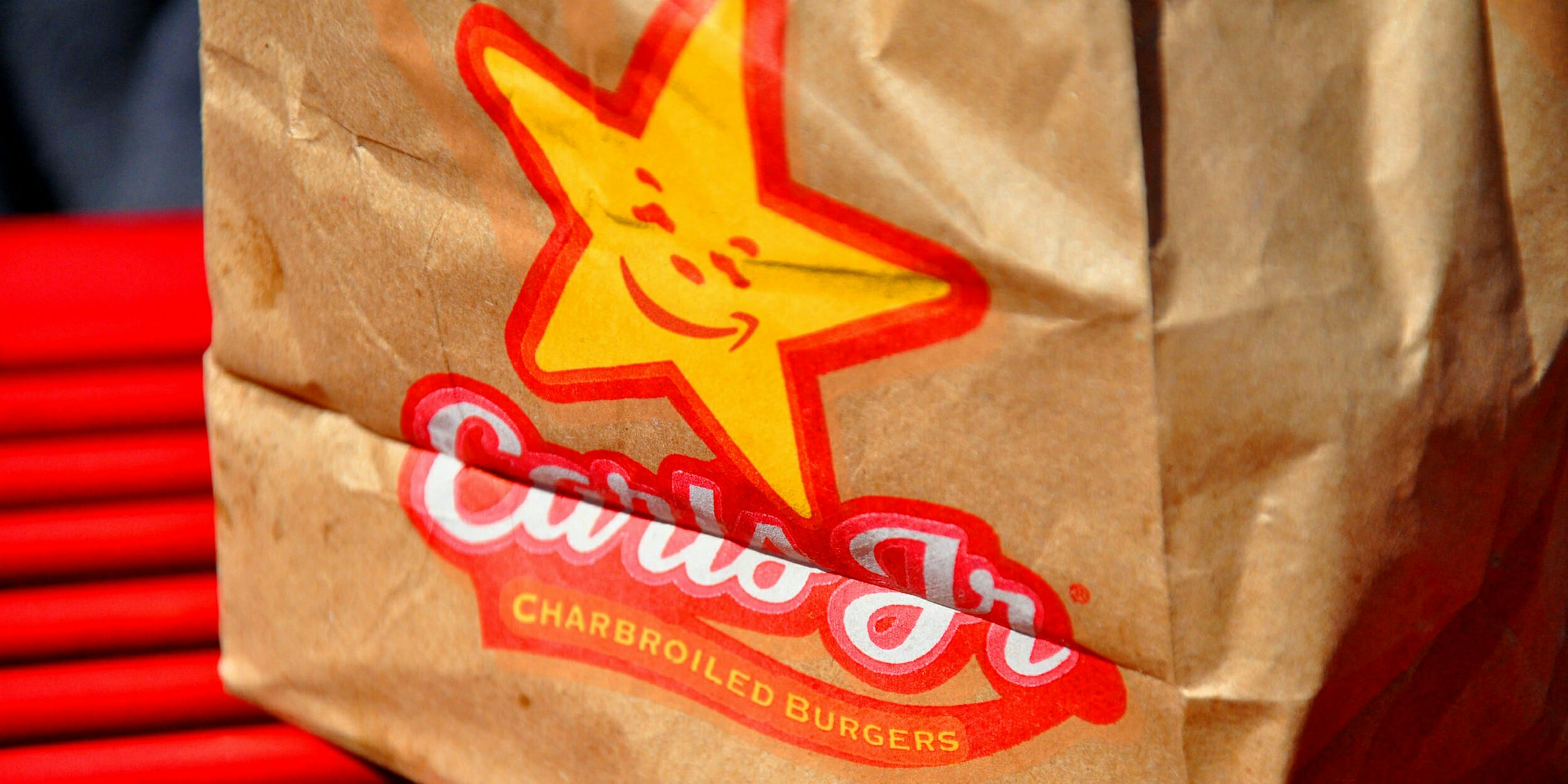 Carls Jr and Amazon logo mashup on a paper bag