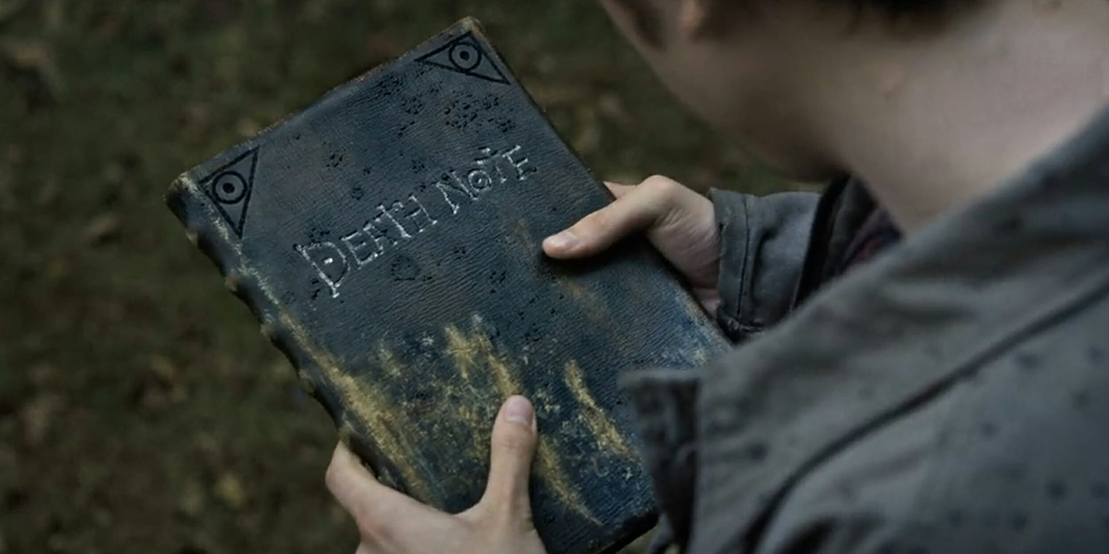 Man holding Death Note book