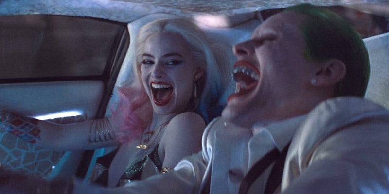 Harley Quinn and Joker laughing in his car