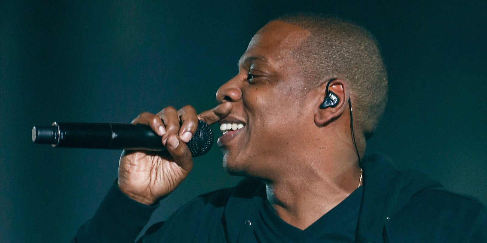 Jay Z smiling while performing