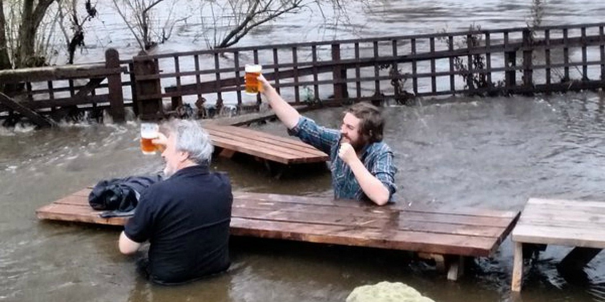 Brits casually share a pint in their flooded beer garden The Daily Dot