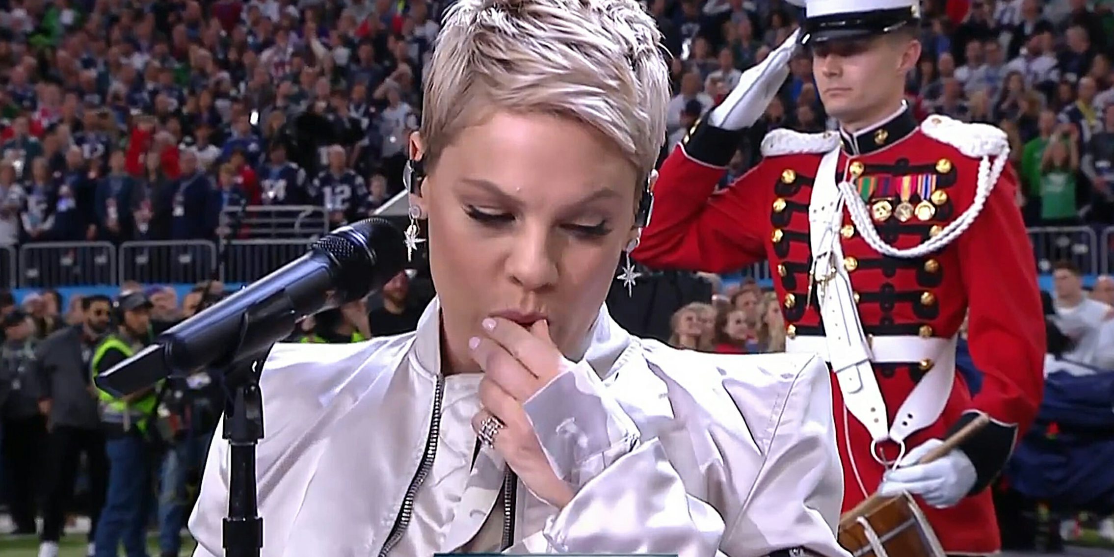 Pink taking cough drop out of her mouth before singing the National Anthem