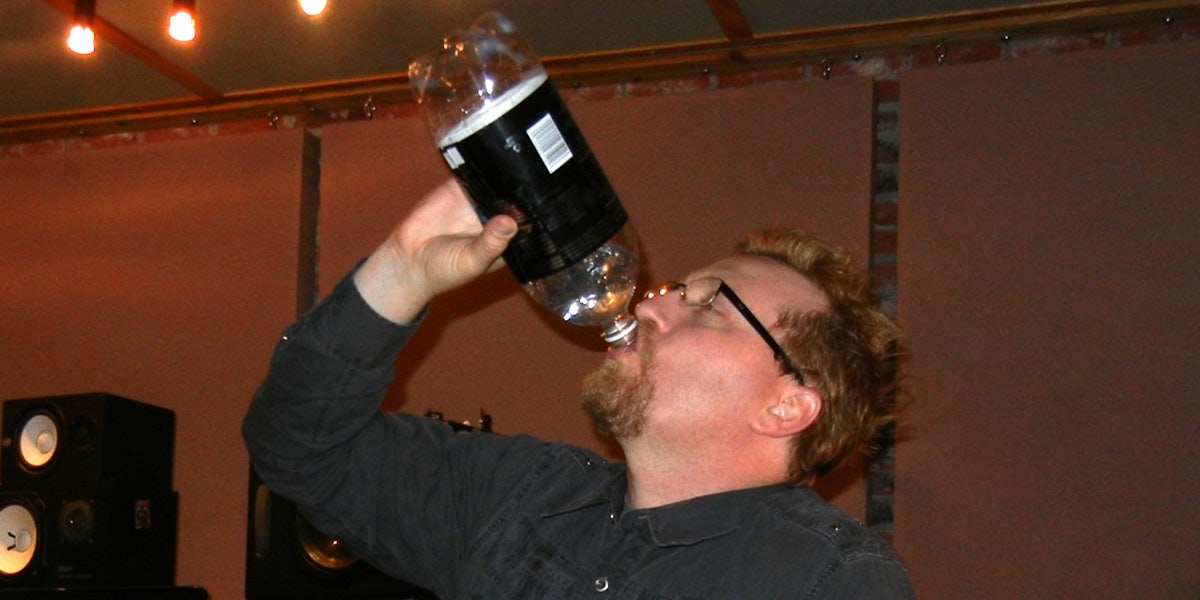 Man chugging 2-liter of soda