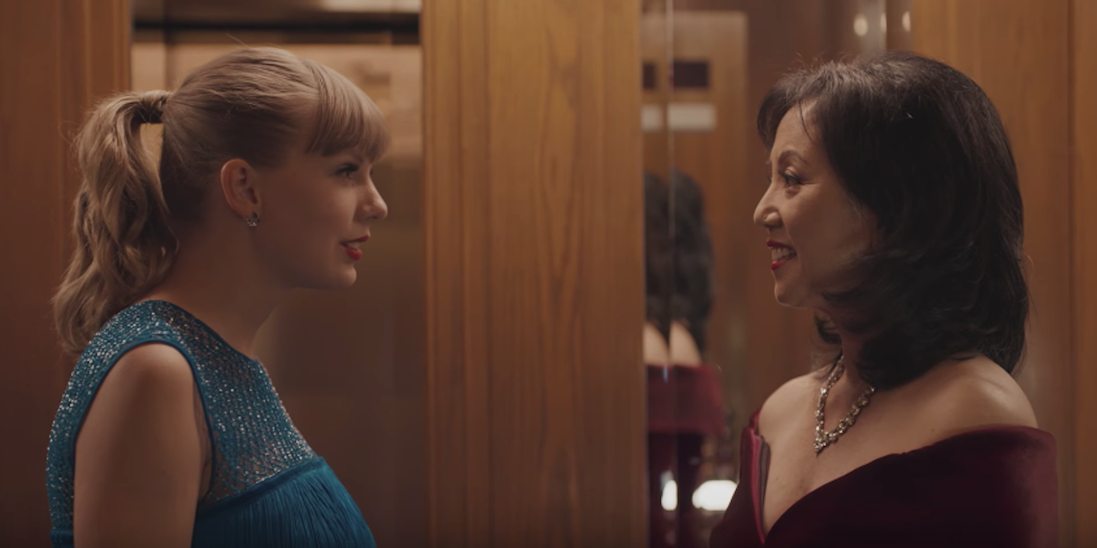 Taylor Swift and Junko Cheng stand face to face in the 'Delicate' video