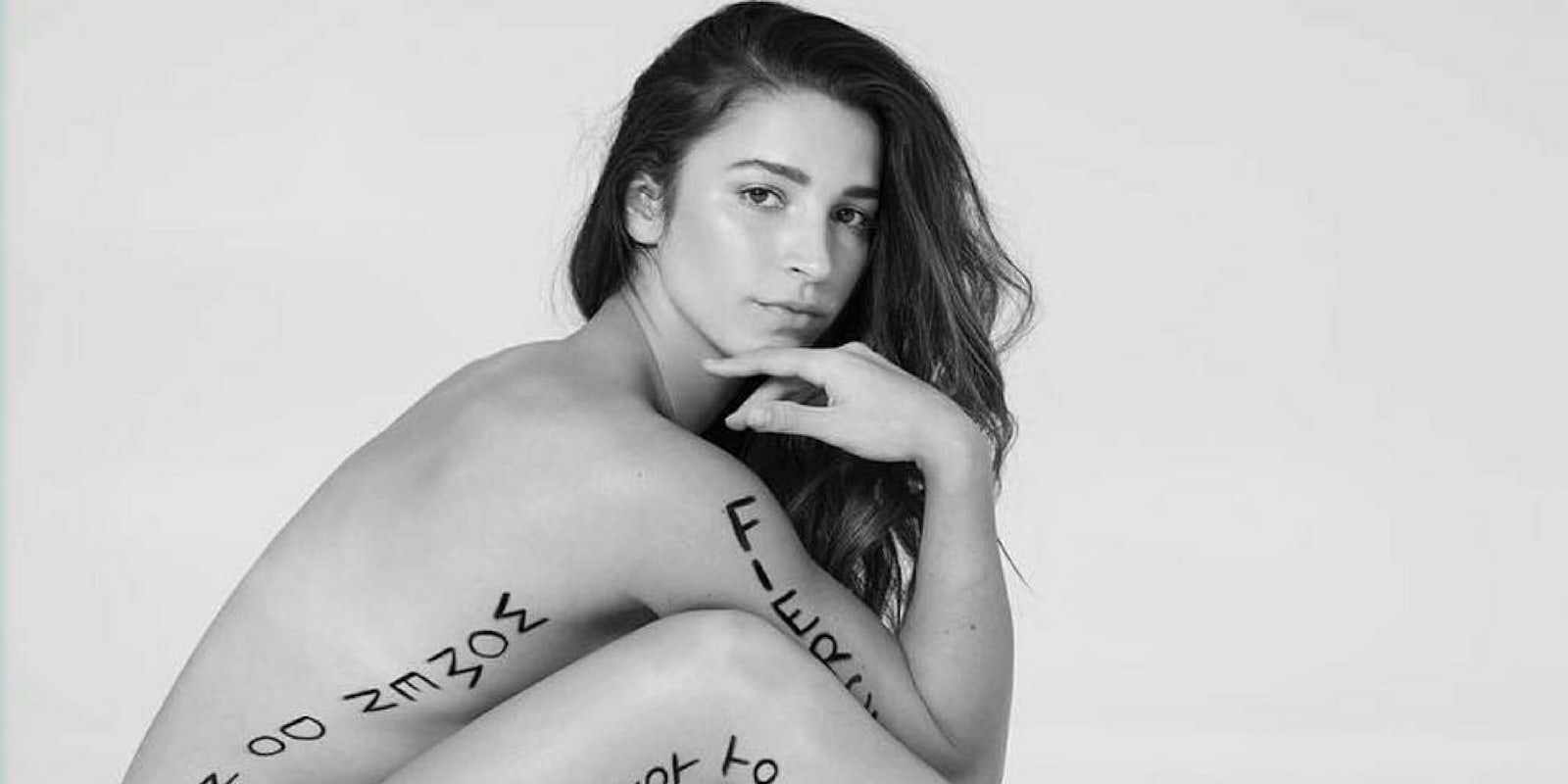 Aly Raisman shares a photo of herself with writing on her body as part of the 'Me Too' project in the 'Sports Illustrated' swimsuit edition.