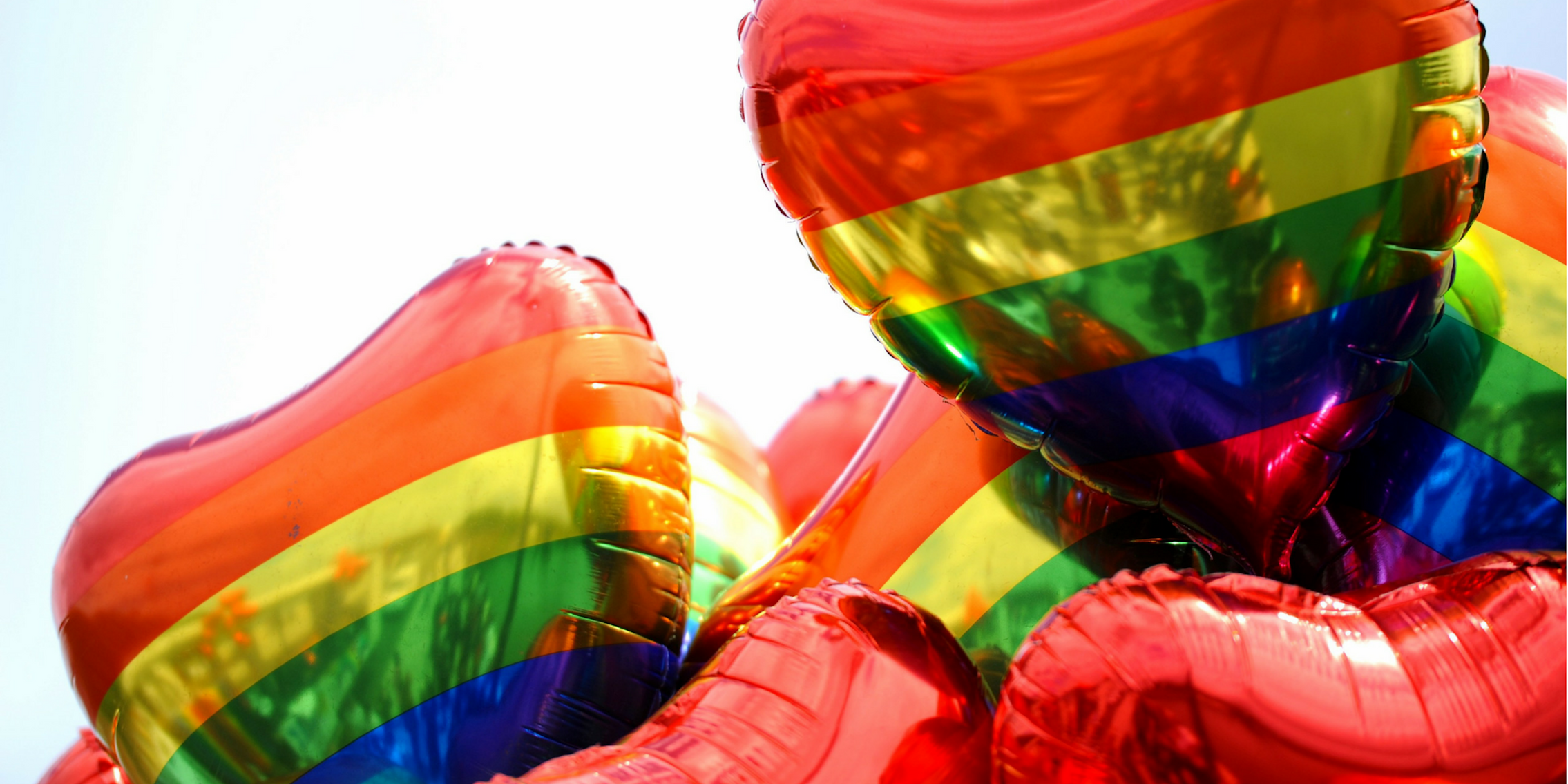 Heart-shaped rainbow gay pride balloons