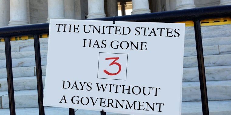 government shutdown day threeThe United States has gone 3 days without a government' sign hanging on fence in front of government building