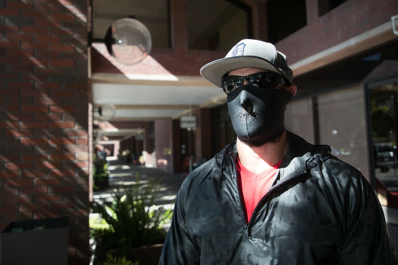 Antifa activist Dominic stands vigilant in San Francisco on Aug. 26. That afternoon, Dominic and others within antifa confronted a group of protesters at Fisherman’s Wharf holding a banner reading, “Love Free Speech, Unafraid of Fake News, Ask Me My Point of View.” Photo via Paul Kuroda/Reveal