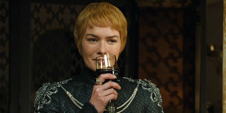 Cersei Lannister sipping wine while watching the Sept of Baelor burn