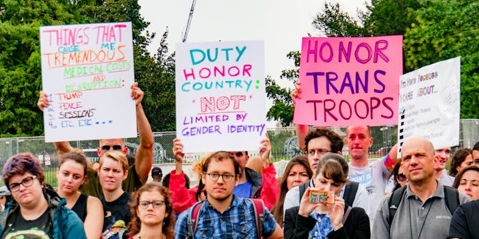 Protesters grouping outside the White House against Trump's transgender military ban.