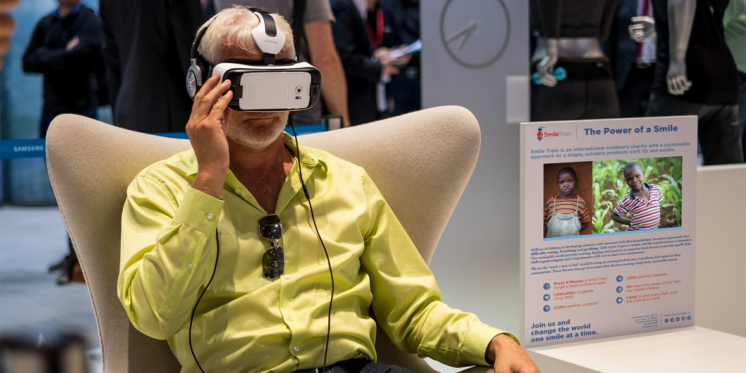 Man viewing virtual reality pitch for charity