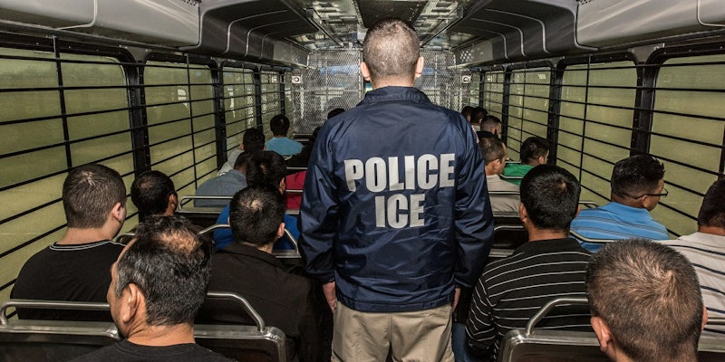 ICE raid : An Immigration and Customs Enforcement officer on a bus in Chicago.