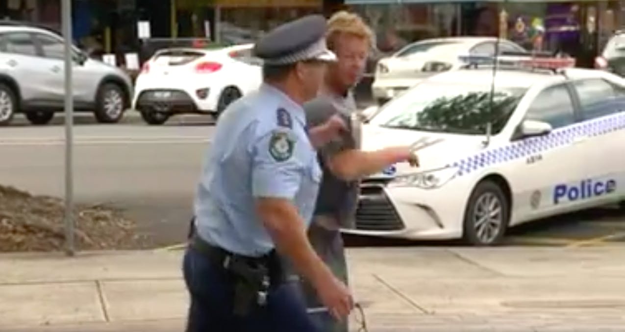 Watch: Police Officer Arrests Drunk Man Who Tried to Interrupt Interview