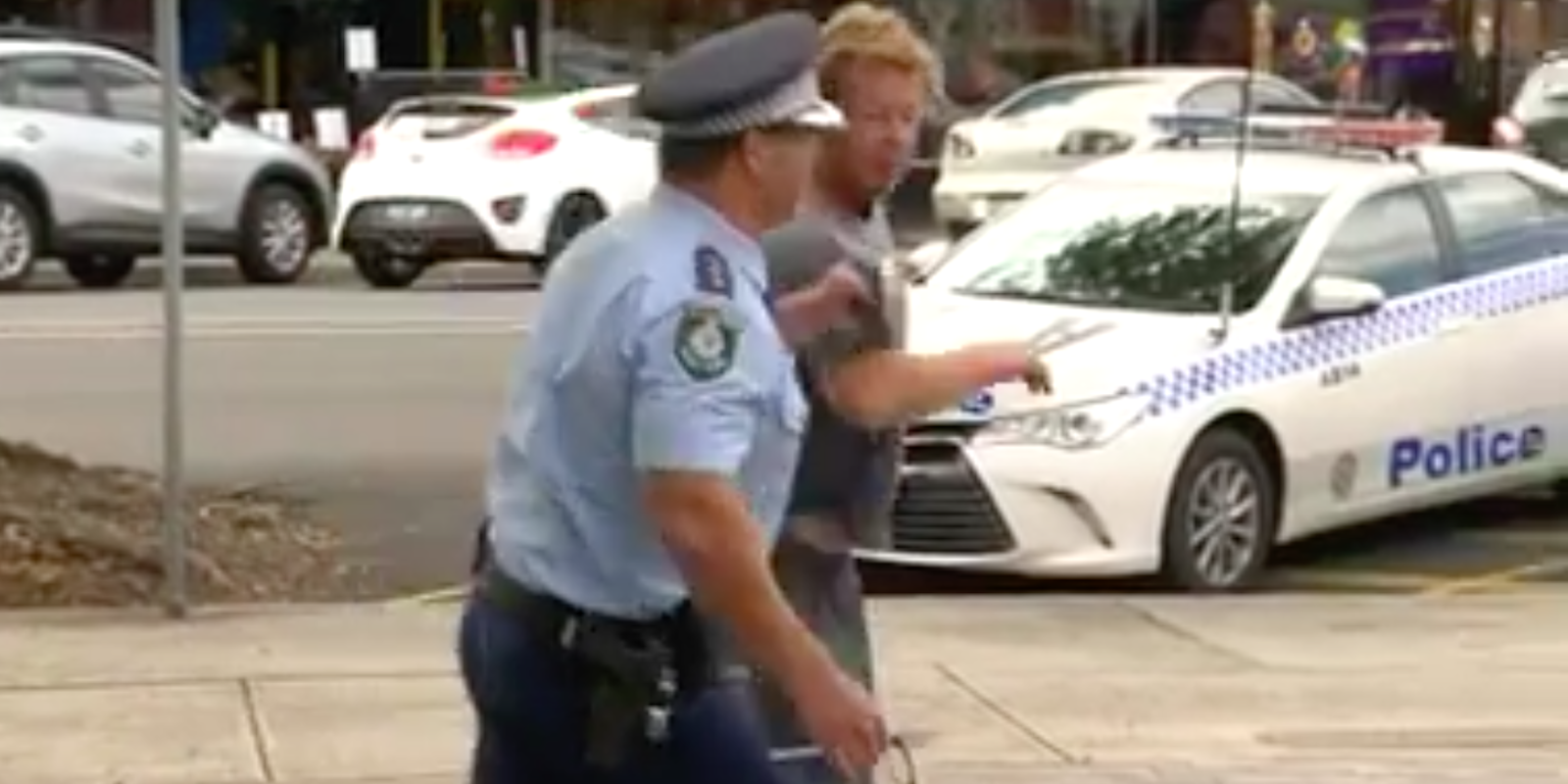 police officer arrests drunk man