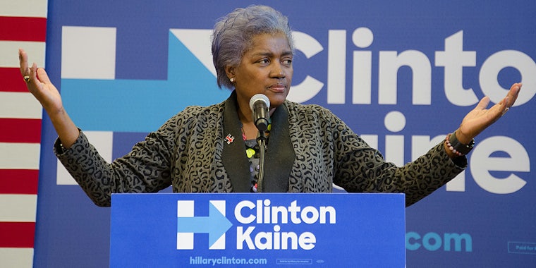 Donna Brazile shrugging at podium during Clinton/Kaine rally