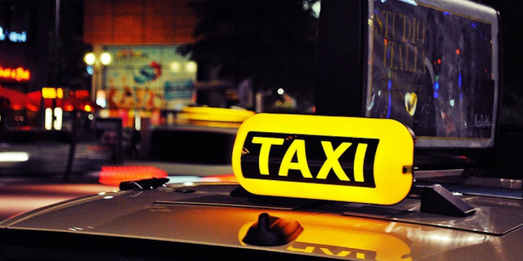 A taxi cab sign lit up