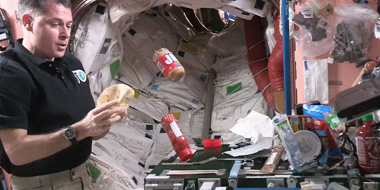 Astronaut making peanut butter and jelly sandwich in space