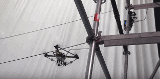 A drone follows a tricky path to wrap rope around a pole.