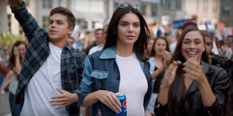 Kendall Jenner depicting a protester with Pepsi in hand during a Pepsi commercial.