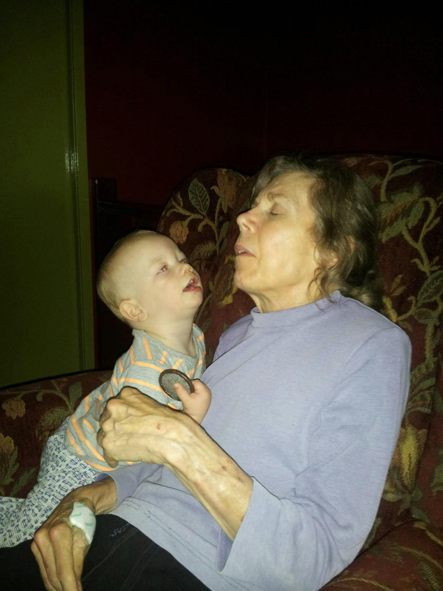 "Cuddles with her 14 month old grandson. He's very careful with her, knows she's special."