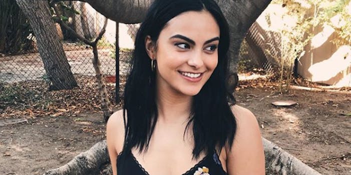 Camila Mendes smiling in a black tank top
