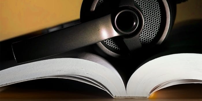 what is audible : Headphones holding open a book