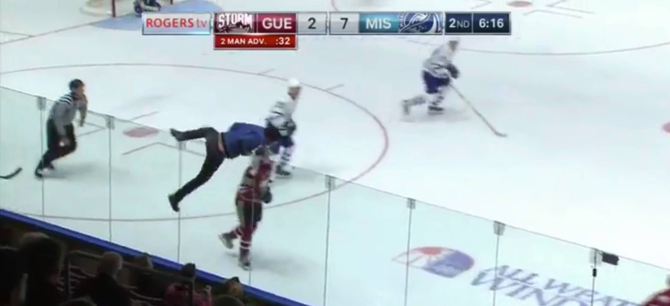 Man Scales Plexiglas to Run Across Ice During Minor League Hockey Game