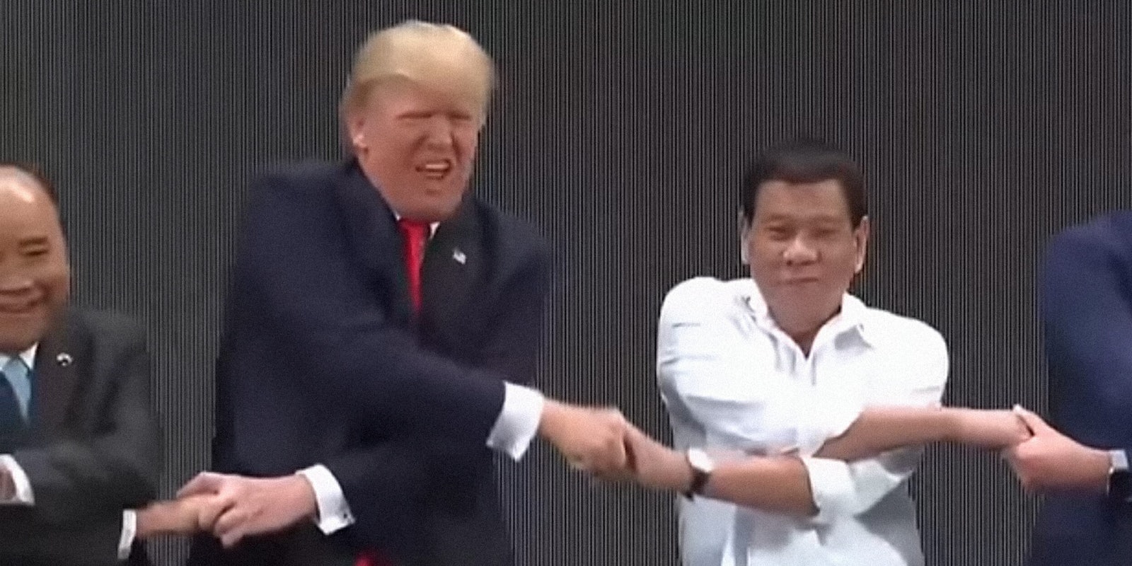Donald Trump awkward handshake at ASEAN conference