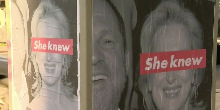Posters of Meryl Streep and Harvey Weinstein with the phrase 'she knew' over Streep's eyes