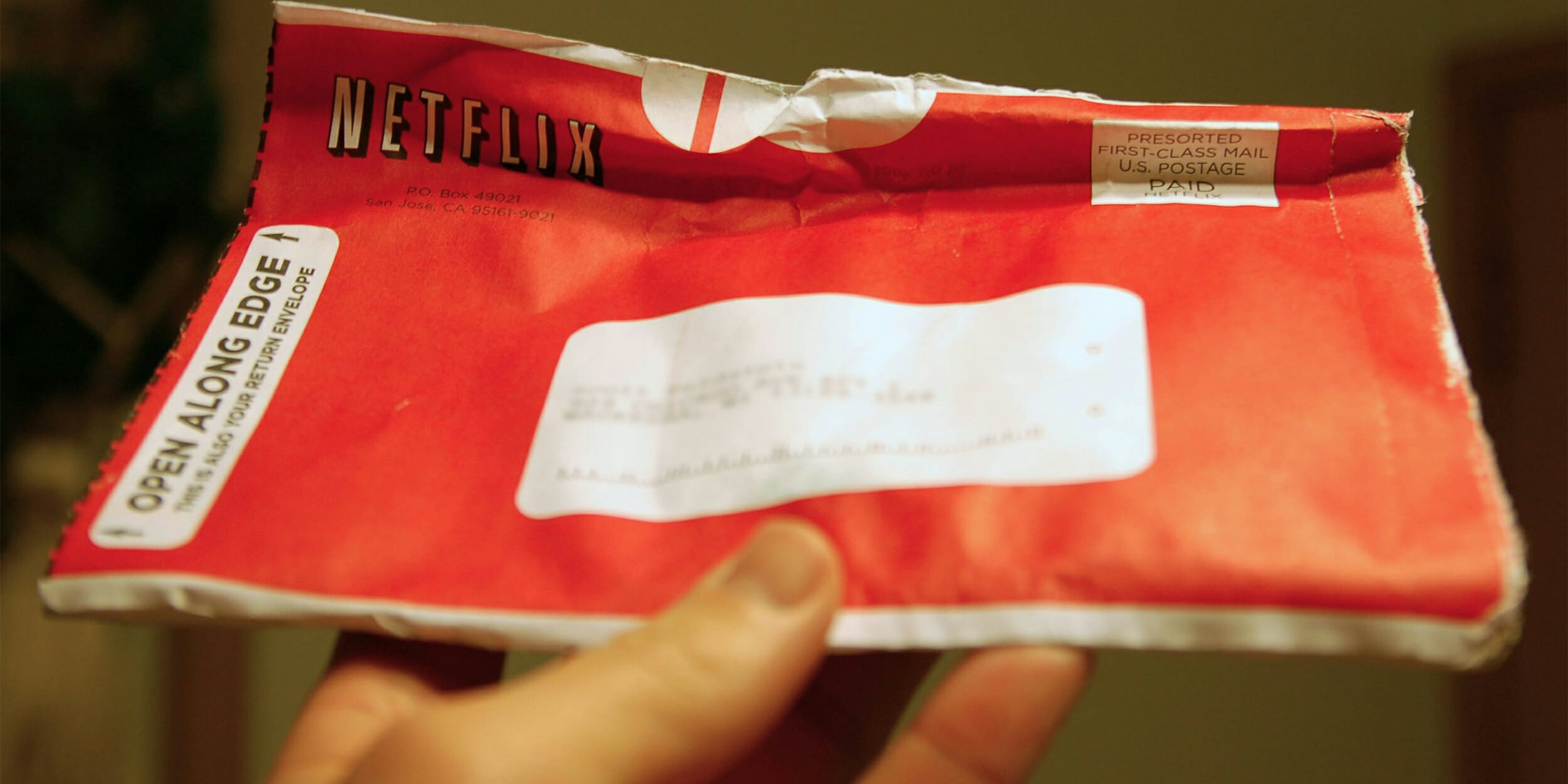 Man holding Netflix envelope