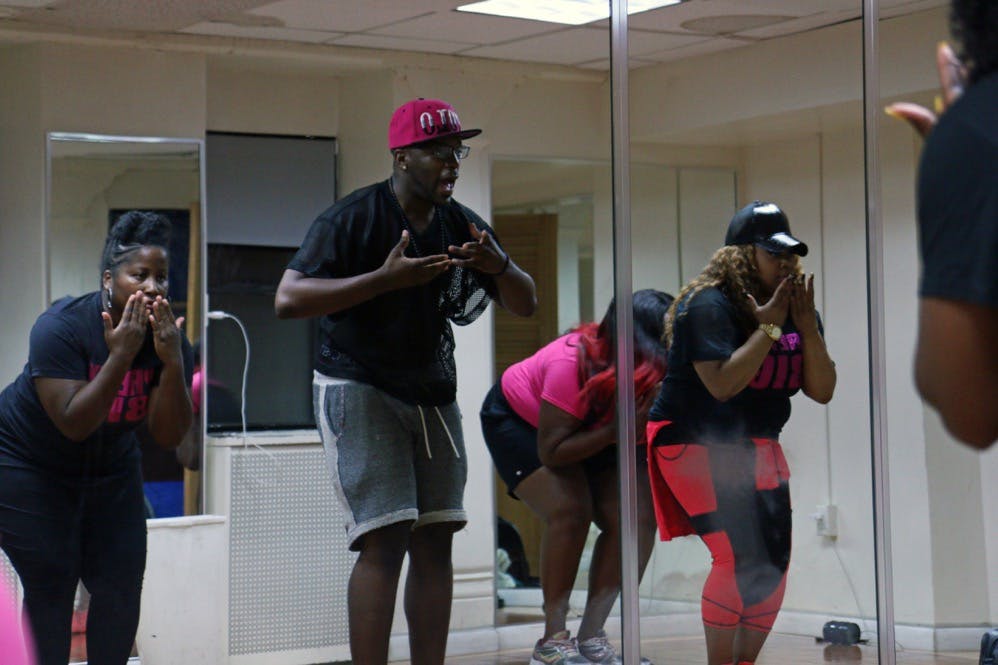 Yancy shows Pretty Big Movement dancers the moves to Lady Leshurr's "Brush Your Teeth." 