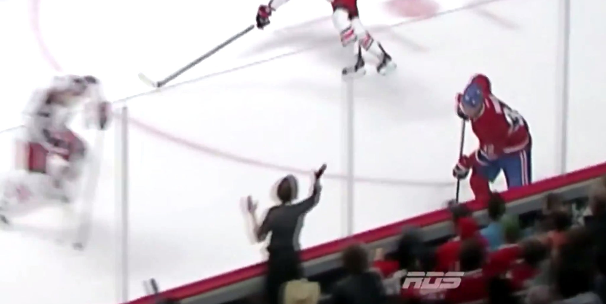 Kid learns the hard way not to bang on the glass at a hockey game