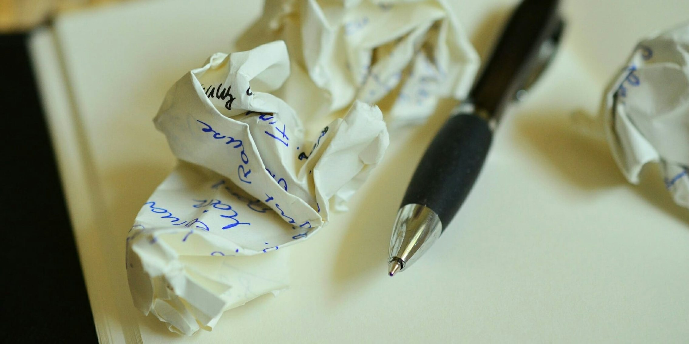 Crumpled up paper while writing letters.
