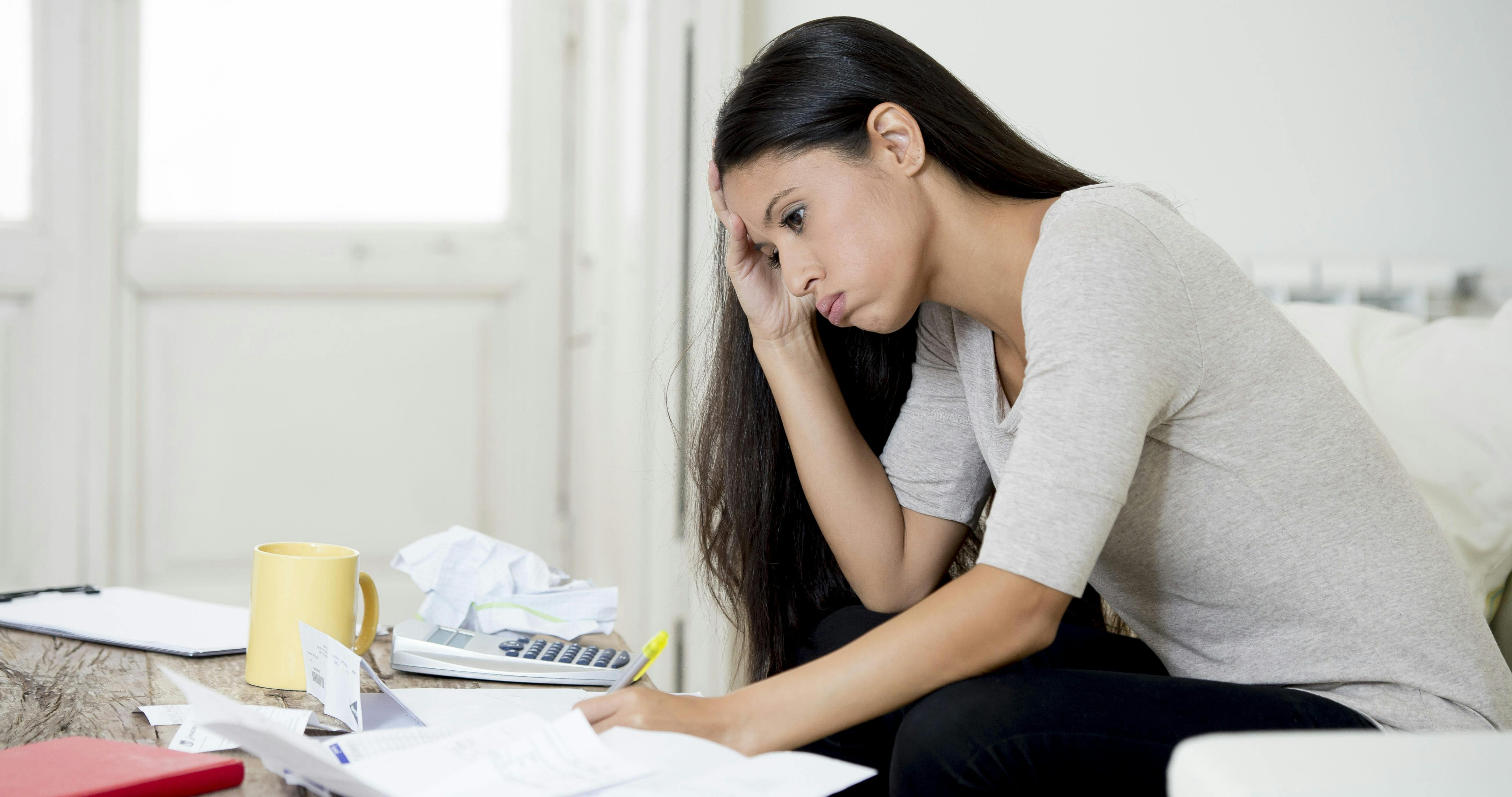 woman taxes paperwork frustrated tax bill