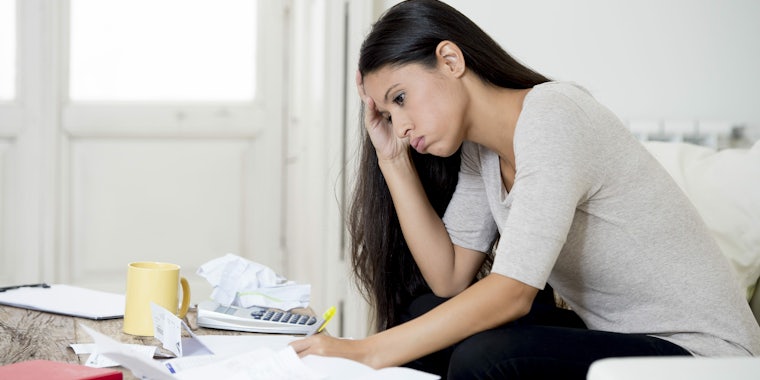 woman taxes paperwork frustrated tax bill
