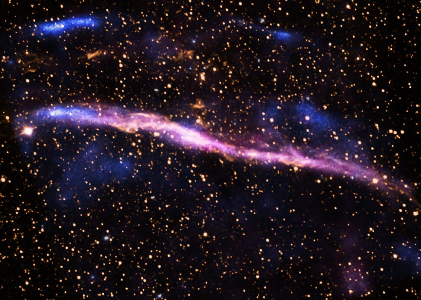 "RCW 86: This supernova remnant is the remains of an exploded star that may have been witnessed by Chinese astronomers almost 2,000 years ago. Modern telescopes have the advantage of observing this object in light that is completely invisible to the unaided human eye. This image combines X-rays from Chandra (pink and blue) along with visible emission from hydrogen atoms in the rim of the remnant, observed with the 0.9-m Curtis Schmidt telescope at the Cerro Tololo Inter-American Observatory (yellow)."