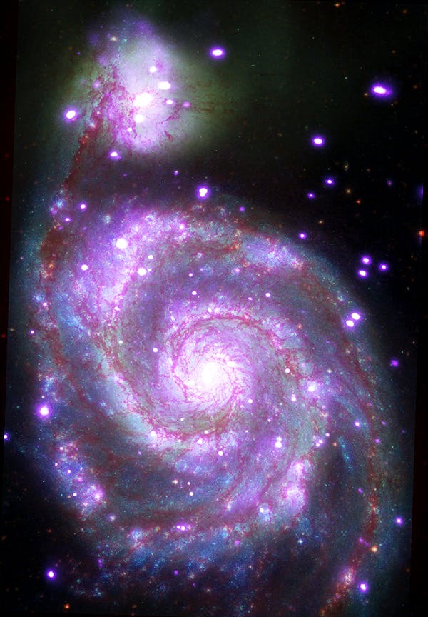 "Messier 51 (M51): This galaxy, nicknamed the 'Whirlpool,' is a spiral galaxy, like our Milky Way, located about 30 million light years from Earth. This composite image combines data collected at X-ray wavelengths by Chandra (purple), ultraviolet by the Galaxy Evolution Explorer (GALEX, blue); visible light by Hubble (green), and infrared by Spitzer (red)."