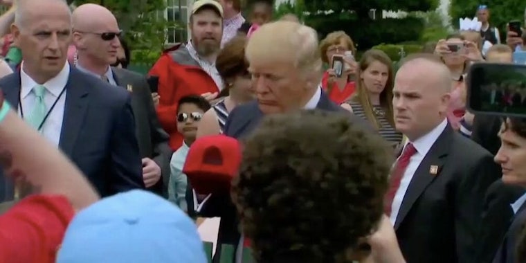 donald trump signs a hat