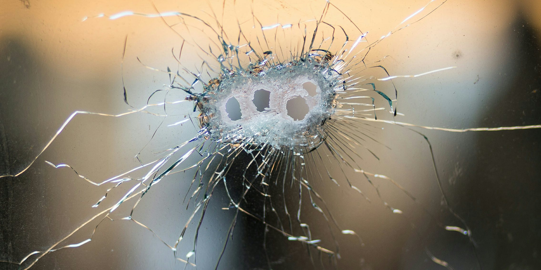 Bullet holes in glass