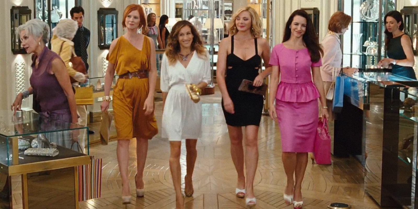 Miranda, Carrie, Samantha and Charlotte walking through a store