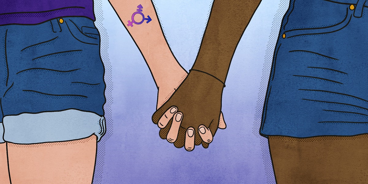 Woman with transgender logo tattoo holding hands with another woman