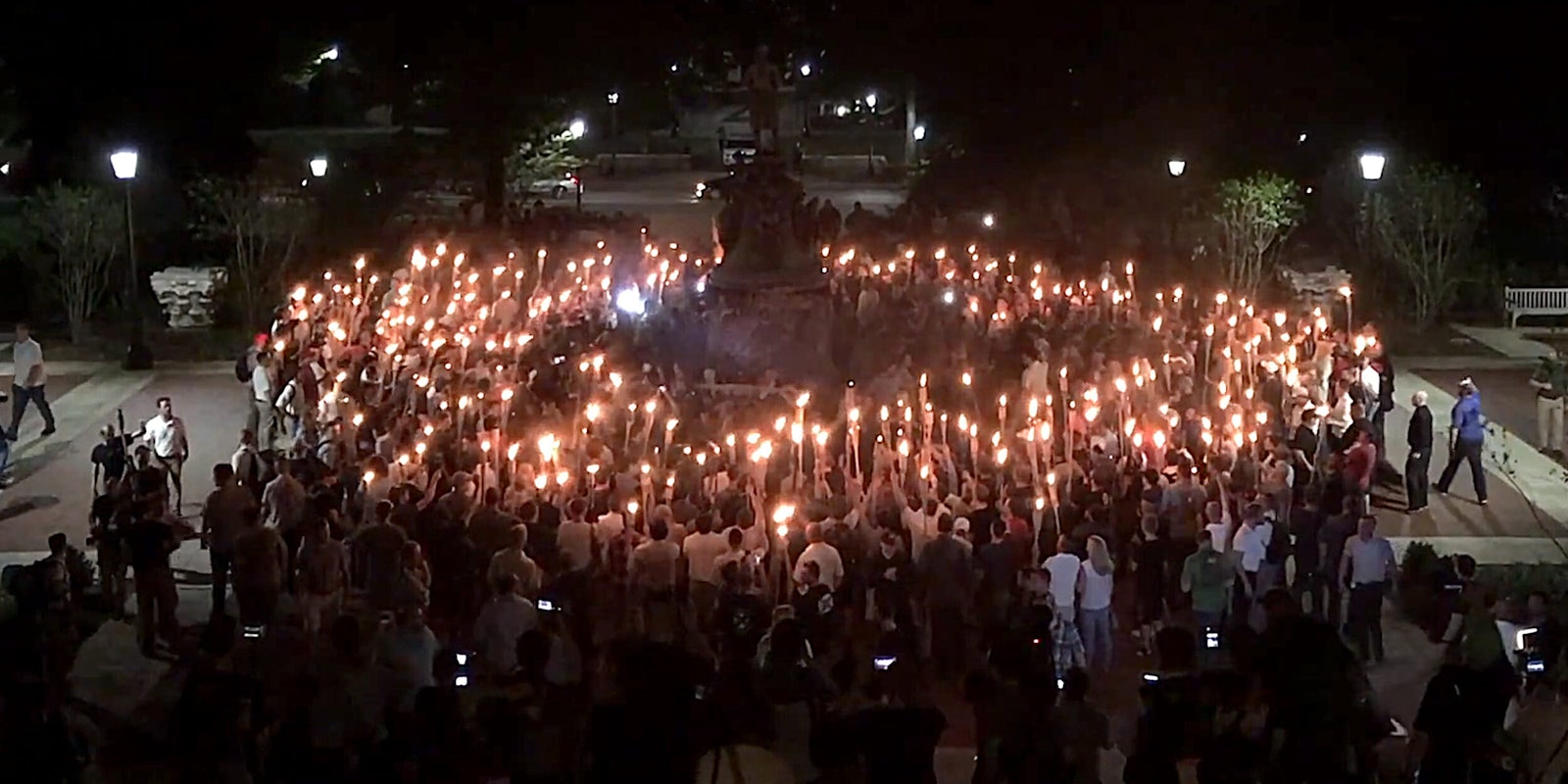 Alt-right white supremacists rally around Confederate statue with tiki torches at UVA